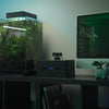Felix 1080P camera sitting on top of KAI Smart Controller, which is controlling a nearby freshwater aquarium.